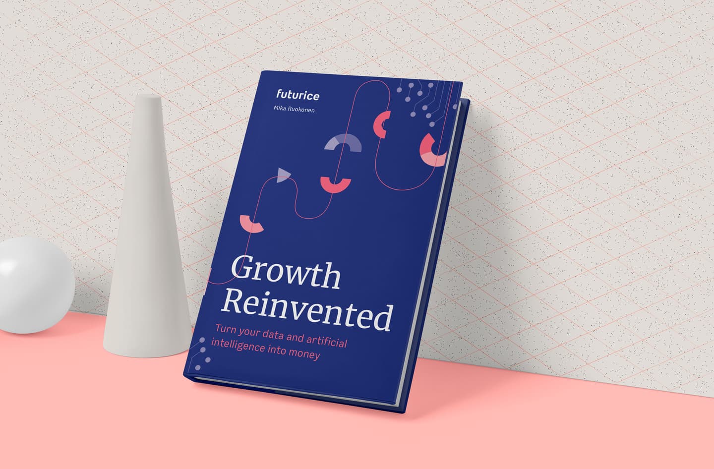 Blue book titled "Growth Reinvented" by Mika Ruokonen displayed on pink surface with minimalist white decorative objects.